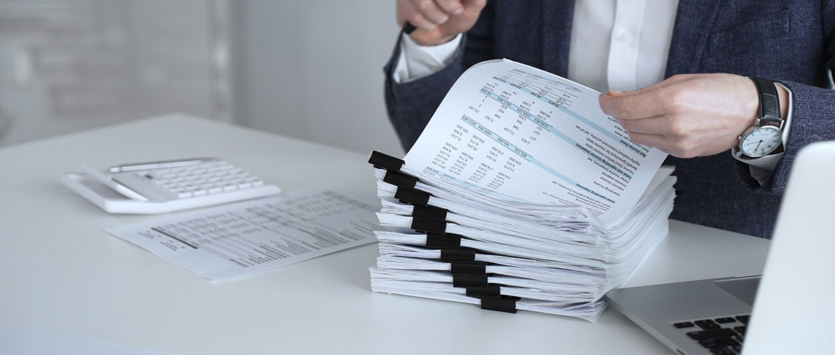 account executive looking through documents